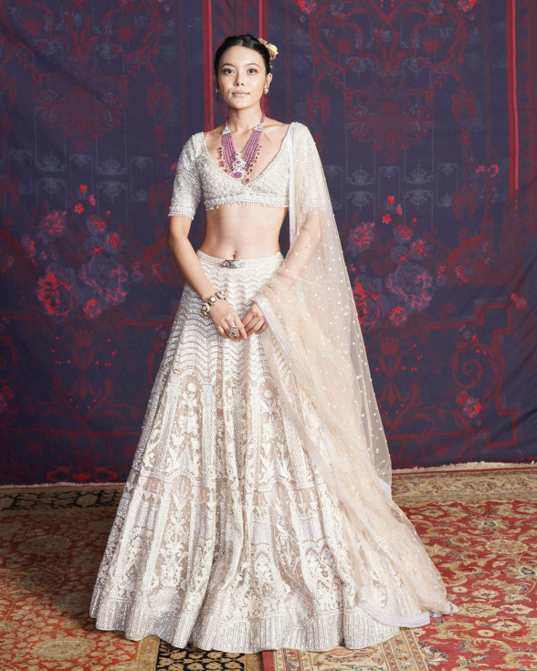 Priscilla Beige-based, Ivory Lehenga Set With A Deep-neck Blouse