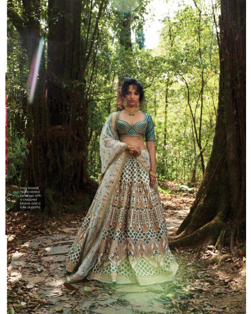 Ivory-based, multicoloured Lehenga with a cropped blouse and a tulle dupatta