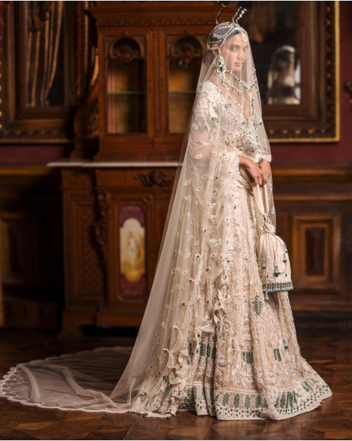 Avice Light Beige-Based, Ivory And Emerald Lehenga Set With Emerald Stones