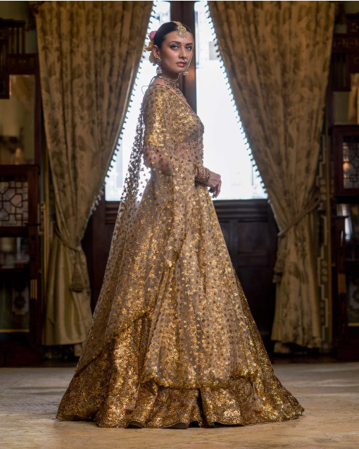 Rouen Golden Lehenga Set With A Cropped Blouse Adorned With Sequins