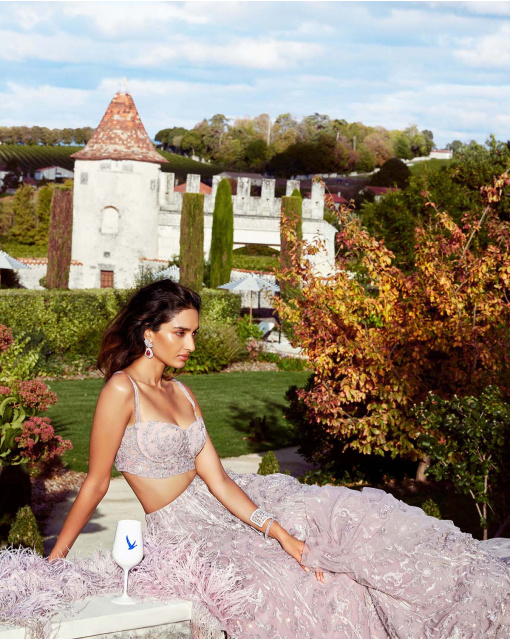 Pink ball gown style lehenga adorned with intricate embroidery