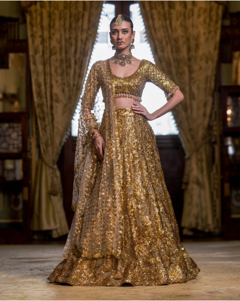Rouen Golden Lehenga Set With A Cropped Blouse Adorned With Sequins