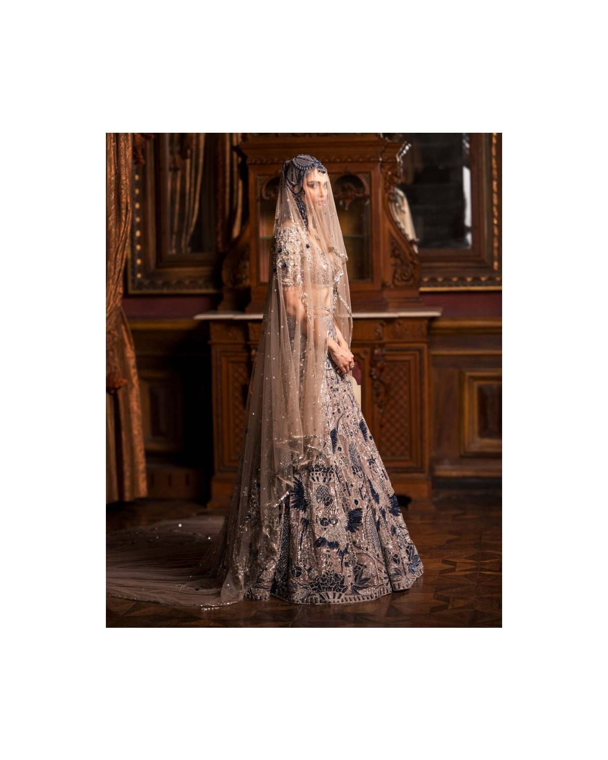 Clarisse Crystal Pink Lehenga Set With Golden And Royal Blue Motifs